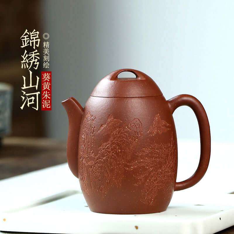 Handmade Yixing purple sand teapot with intricate mountain and river design, crafted from original purple clay.