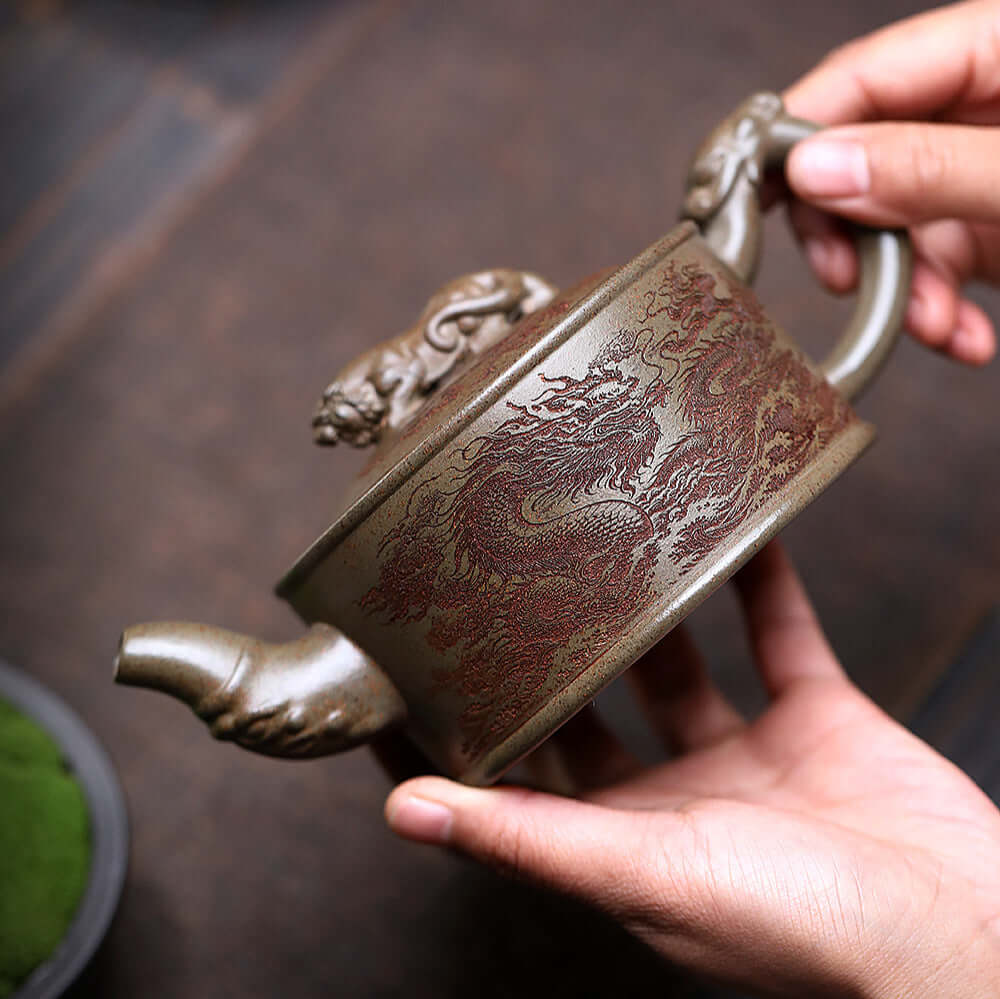 Handmade Yixing purple sand teapot featuring dragon design, showcasing artisan craftsmanship and unique style.