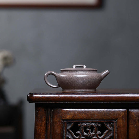 Handmade Yixing purple sand teapot crafted from raw ore, perfect for home kung fu tea sets.
