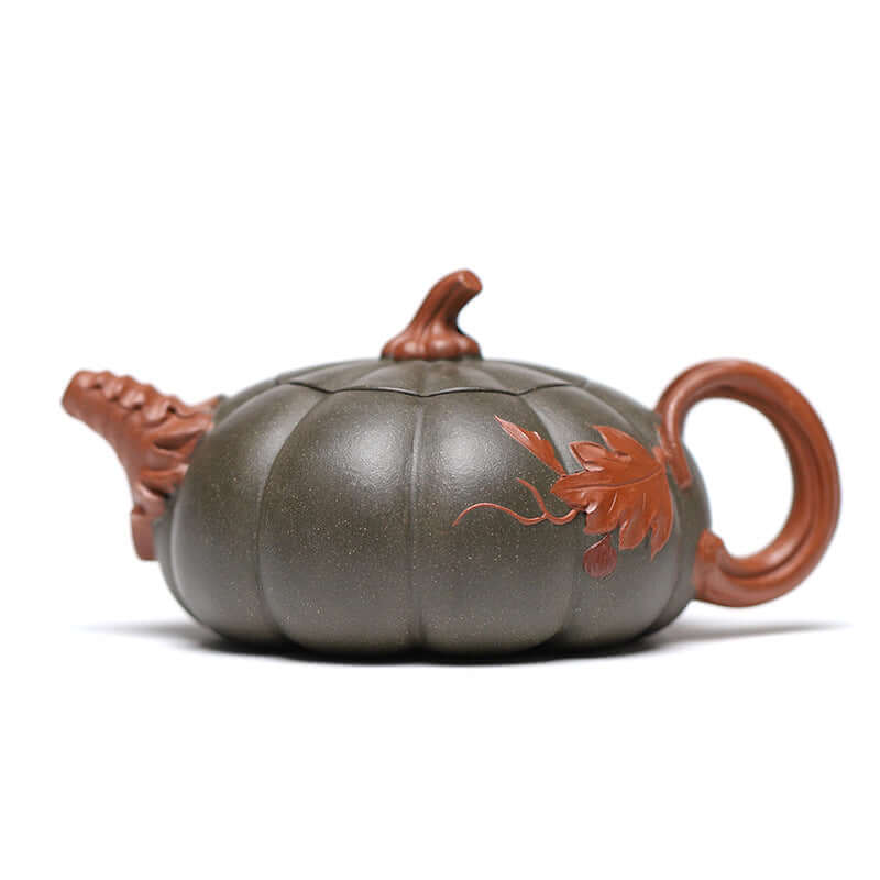 Handmade Yixing purple sand teapot in pumpkin shape with intricate leaf design, showcasing unique craftsmanship and elegance.