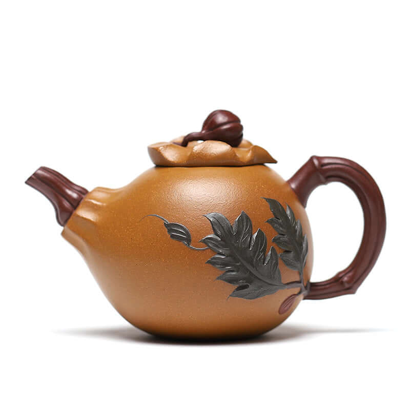 Handmade Yixing purple sand teapot in golden gourd shape with leaf design, perfect for home tea sets.