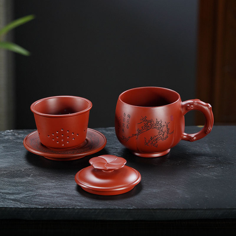 Handmade Yixing purple sand tea cup set with lid and infuser, featuring plum blossom design for traditional tea brewing.