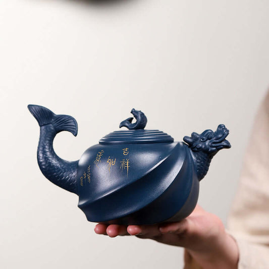Handmade Yixing purple sand teapot with fish dragon design, showcasing craft details and unique elegance.