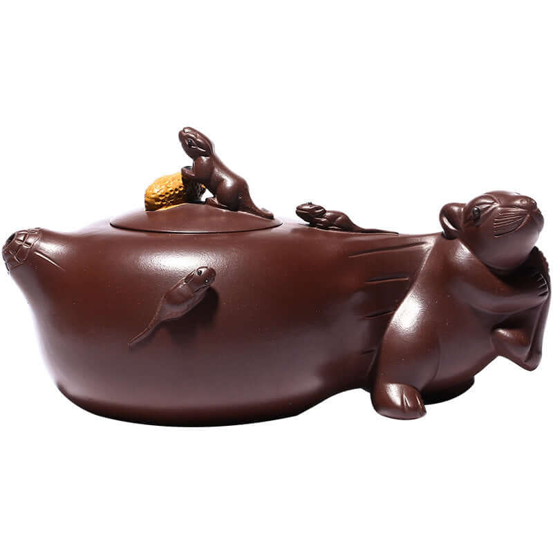 Handmade Yixing purple sand teapot shaped like a mouse family, featuring intricate details and a unique design.