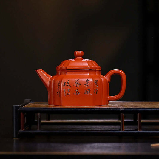 Handmade Yixing purple sand teapot featuring traditional Chinese calligraphy, ideal for tea lovers.