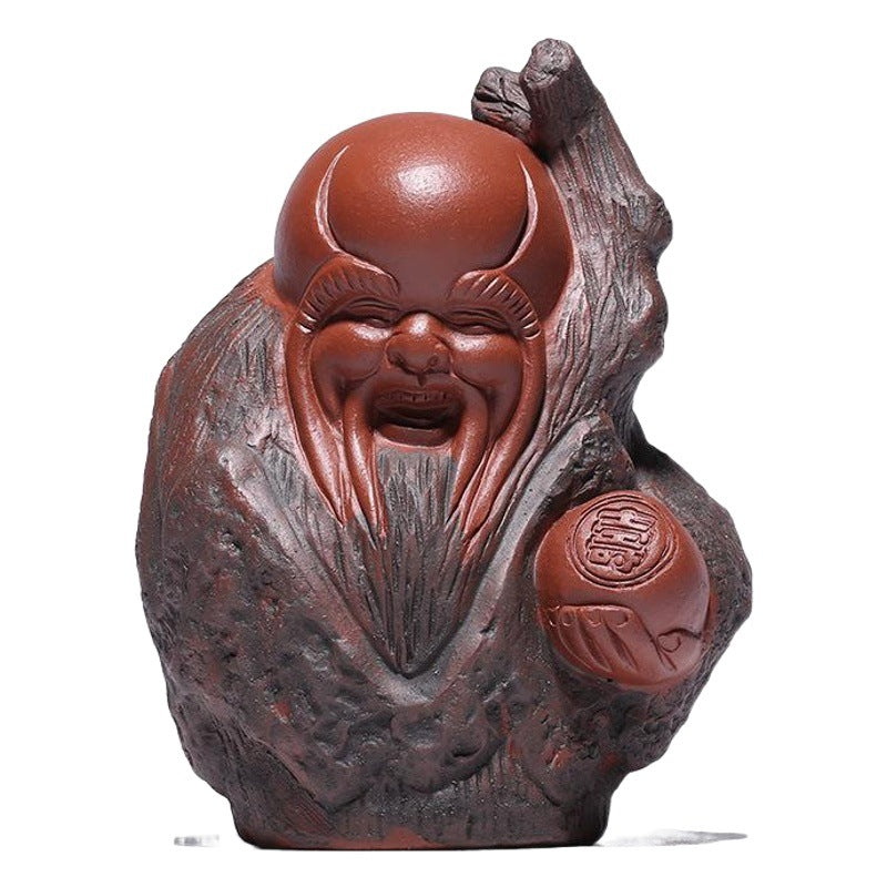 Handmade Yixing purple sand tea pet figurine, depicting a joyful deity for tea ceremony decoration.