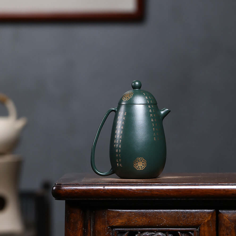 Handmade Yixing purple sand teapot in dark green with gold accents, perfect for home kung fu tea set.