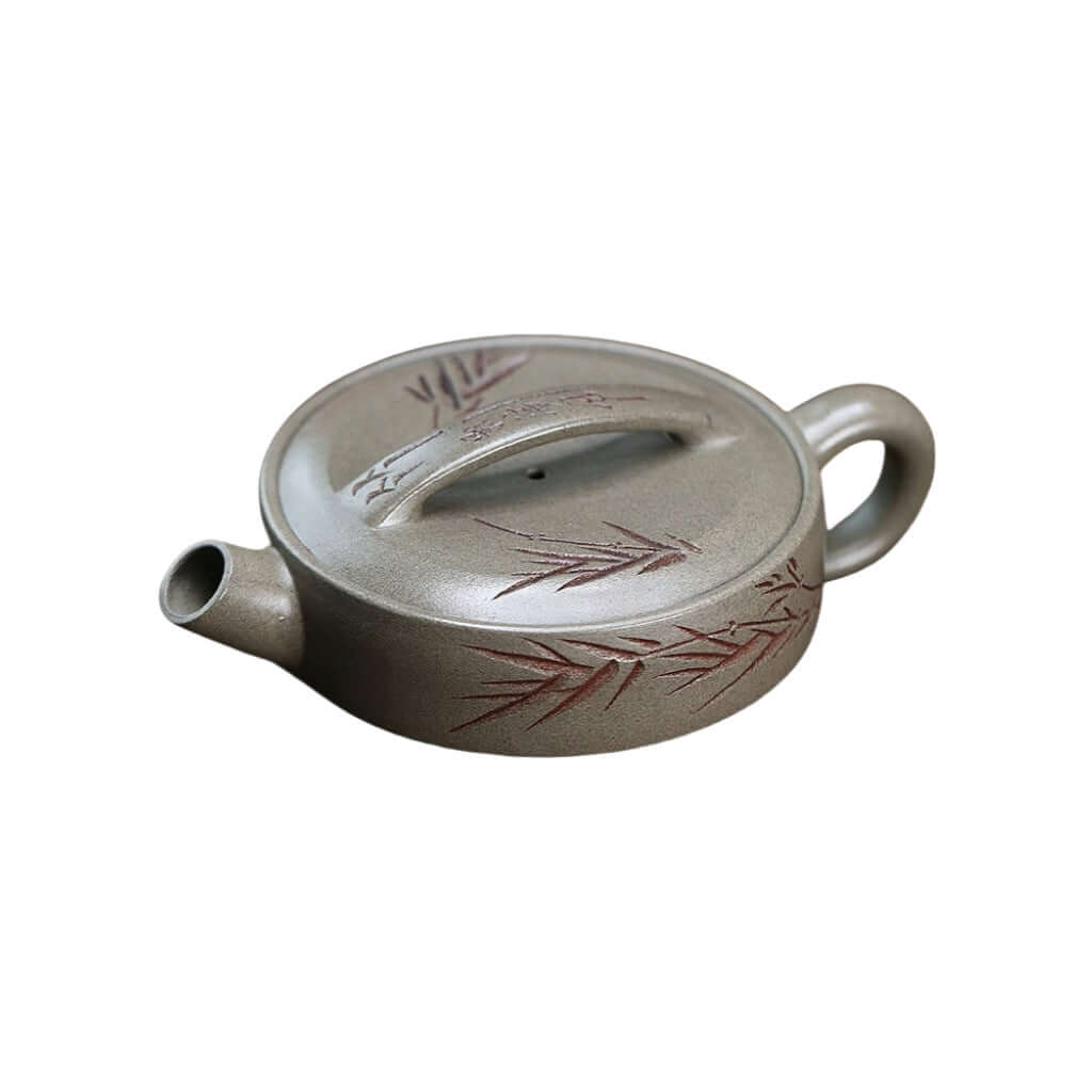 Handmade Yixing purple sand teapot with crab shell design and bamboo motif, perfect for kung fu tea sets.