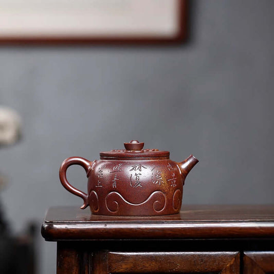 Handmade Yixing purple sand teapot with intricate design, perfect for tea enthusiasts and collectors.