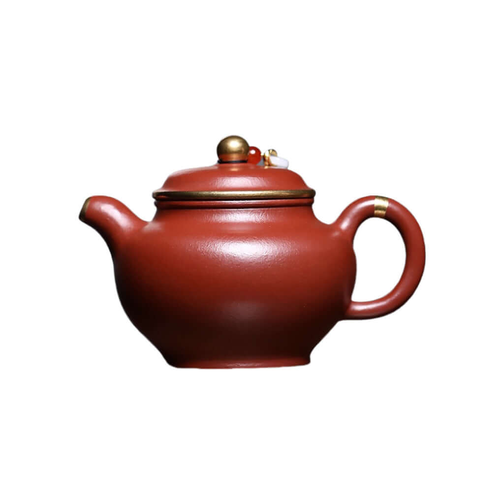 Handmade Yixing purple sand teapot with mineral wrinkled surface, gold inlaid, perfect for Kung Fu tea sets.