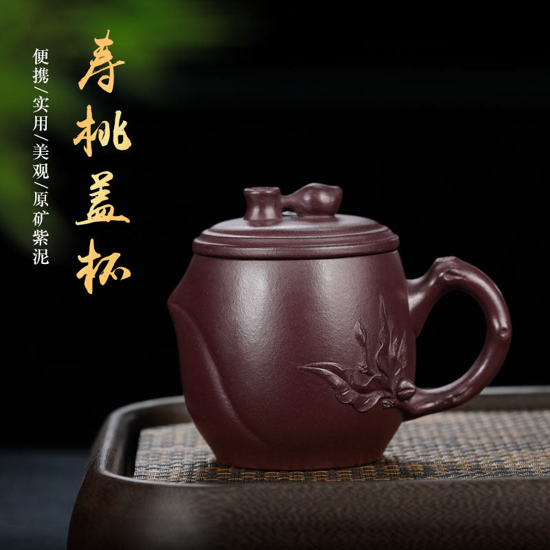 Handmade Yixing purple sand office cup with cover, showcasing intricate designs, perfect for tea enthusiasts.