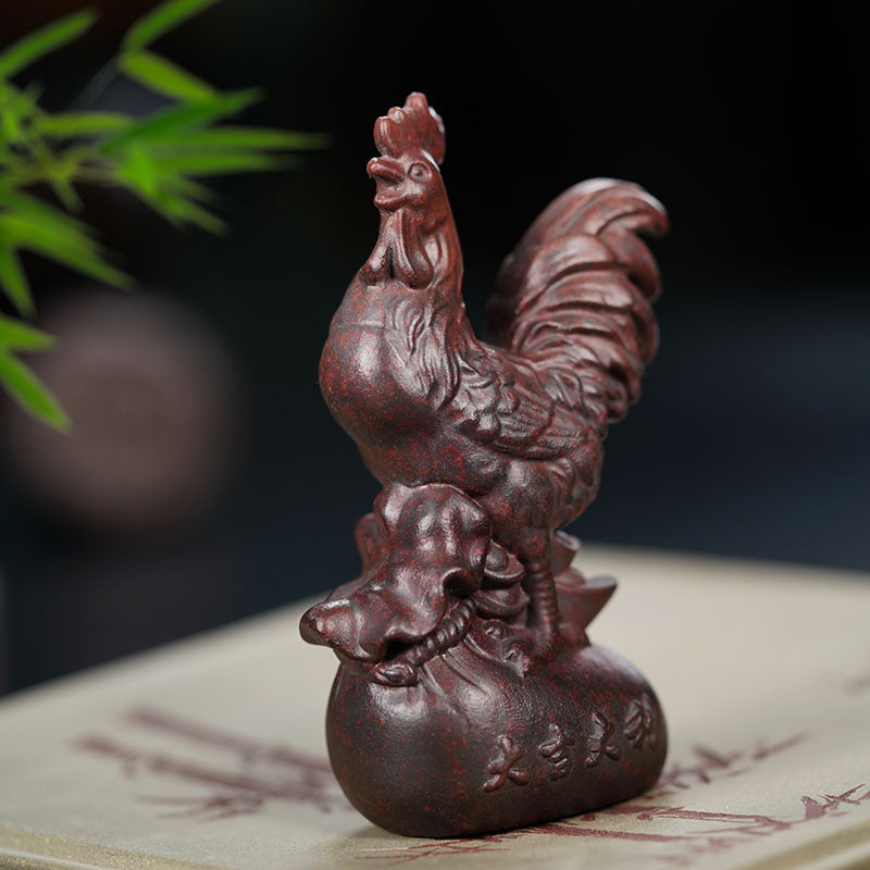 Handmade Yixing purple sand tea pet ornament featuring a rooster and a duck for good luck, crafted by skilled artisans.