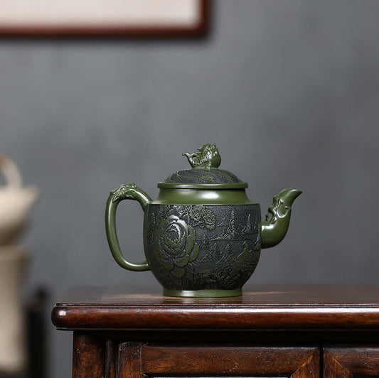 Handmade Yixing purple sand teapot featuring intricate flower and bird design, perfect for Kung Fu tea set.