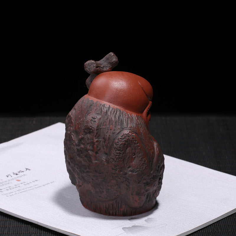 Handmade Yixing purple sand tea pet, unique design, perfect for tea ceremony decoration and gifting.
