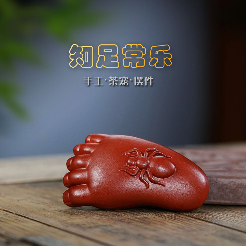 Handmade Yixing purple sand tea pet ornament, featuring a foot sculpture with an ant design, perfect for tea ceremonies.