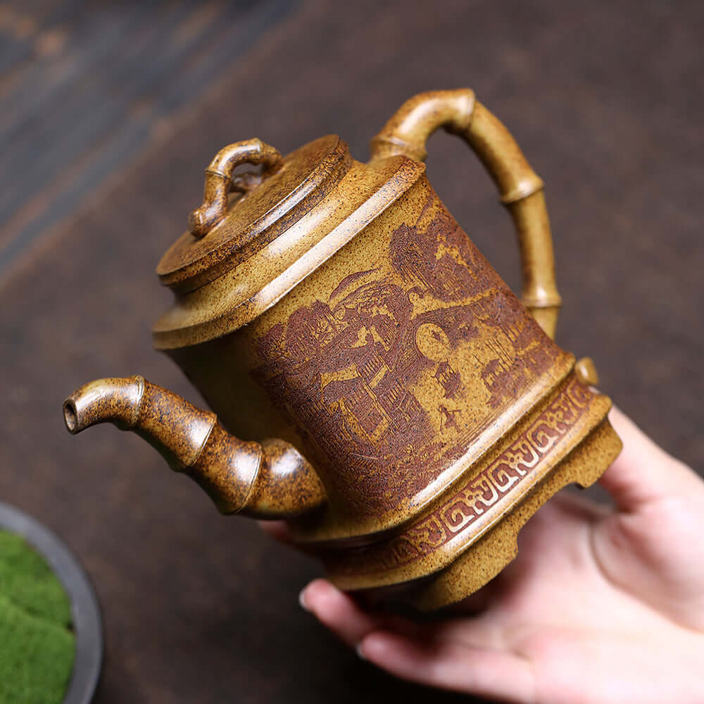 Handmade Yixing purple sand teapot featuring a detailed design, perfect for home kung fu tea sets.