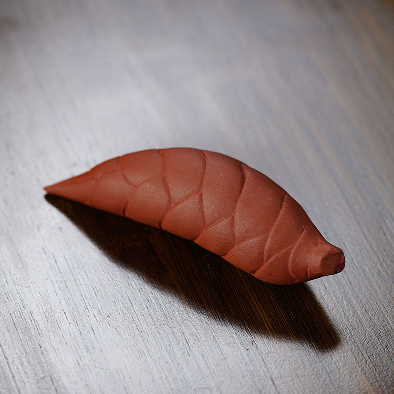 Handmade Yixing purple sand tea pet, unique leaf design, perfect accessory for tea enthusiasts.