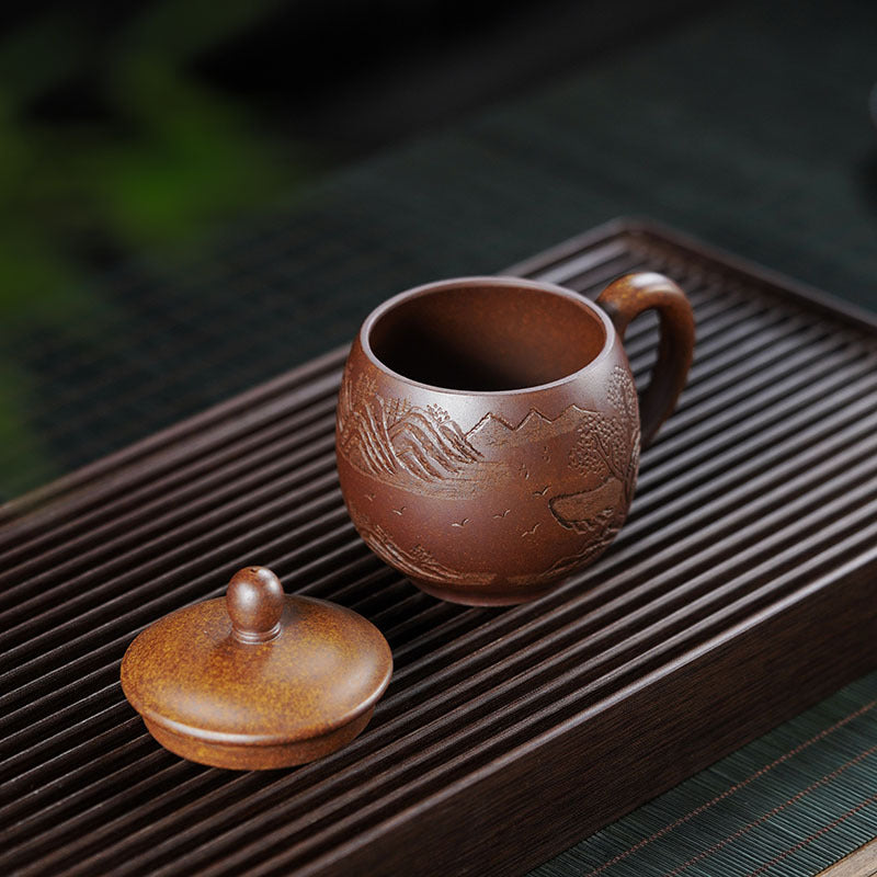 Handmade Yixing purple sand tea cup with lid, mountain design, small capacity for women, perfect for tea enthusiasts.