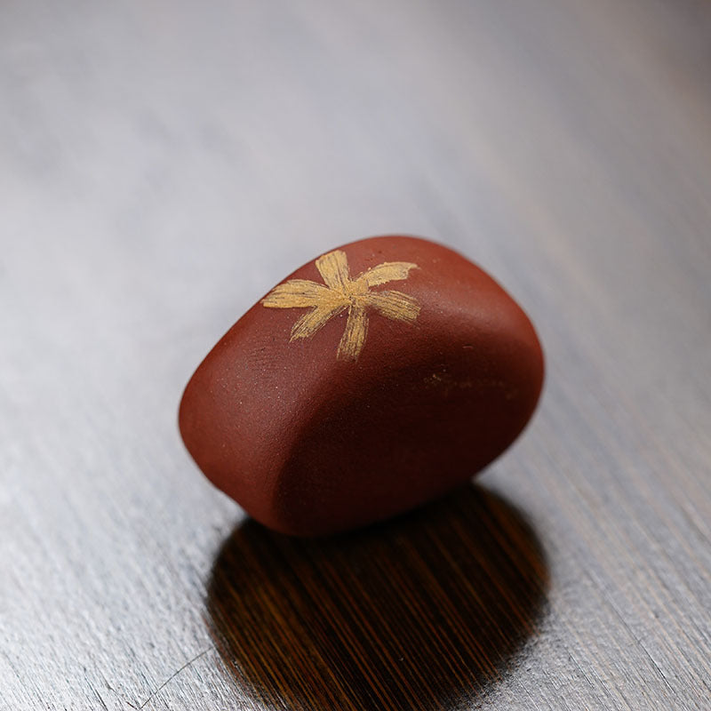 Handmade Yixing purple sand tea pet ornament with floral design, perfect for tea ceremonies and decor.