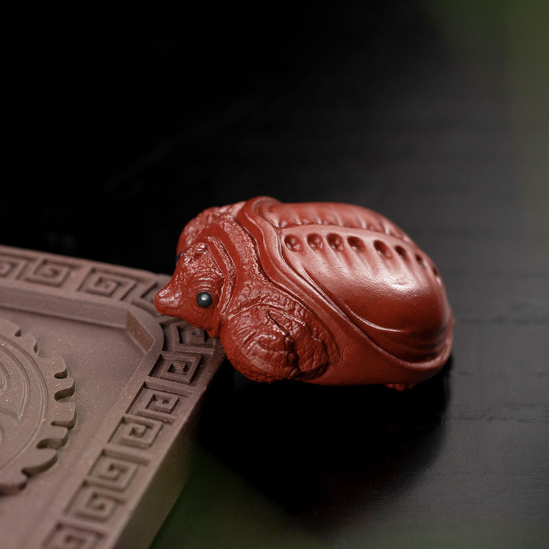 Handmade Yixing purple sand tea pet ornament in the shape of a turtle, perfect for tea sets and collectors.