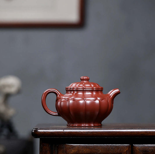 Handmade Yixing purple sand teapot with dragon rib pattern, perfect for home kung fu tea set.