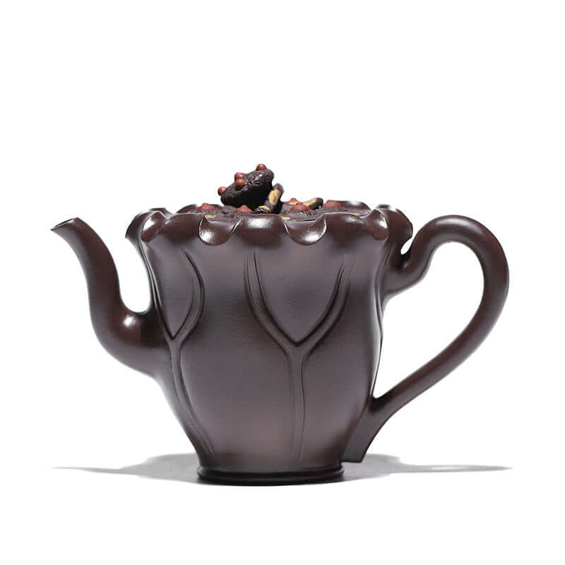 Handmade Yixing purple sand teapot shaped like a lotus flower, showcasing fine craftsmanship and elegant design.