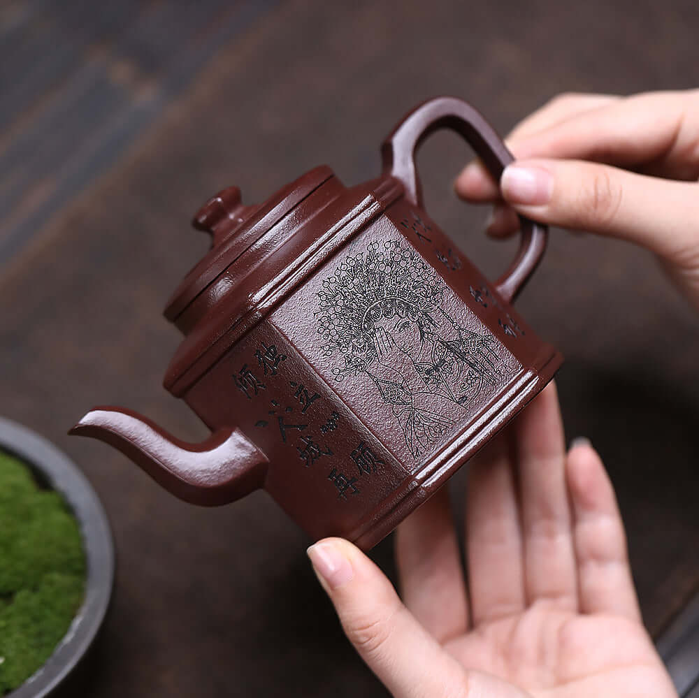Handmade Yixing purple sand teapot with engraved design, showcasing raw purple clay craftsmanship, perfect for tea lovers.