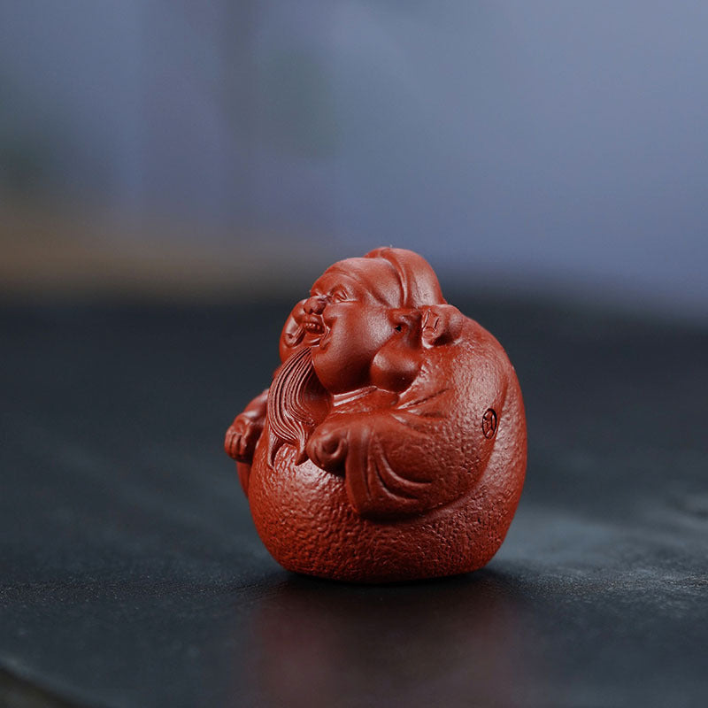 Handmade Yixing purple sand tea pet ornament, sculpted God of Wealth, perfect for tea table and Kung Fu tea set.