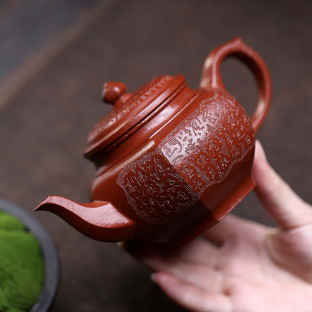 Handmade Yixing purple sand teapot with intricate design, perfect for kung fu tea ceremonies and collectors.