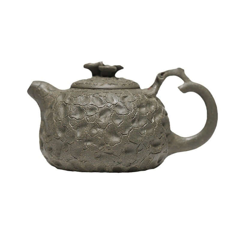 Handmade Yixing purple sand teapot with unique texture, crafted from original purple sand for tea enthusiasts.
