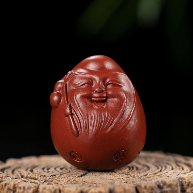 Handmade Yixing purple sand tea pet ornament, happy egg design, perfect gift for tea lovers.