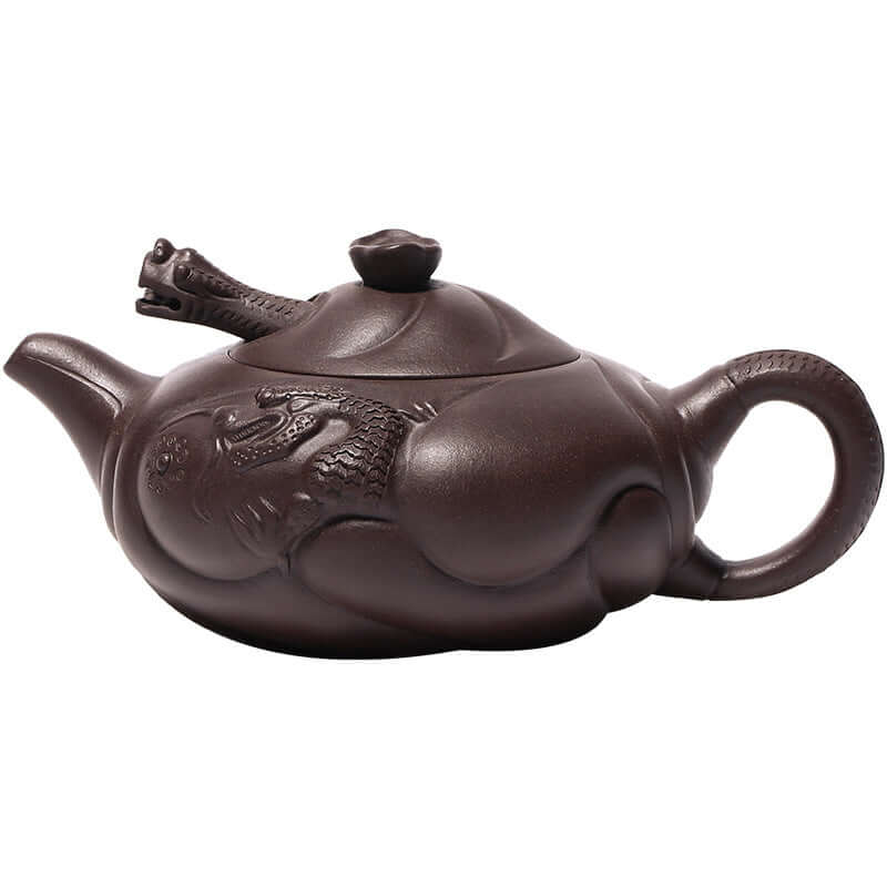 Handmade Yixing purple sand teapot featuring intricately carved fish dragon design, ideal for kung fu tea set.