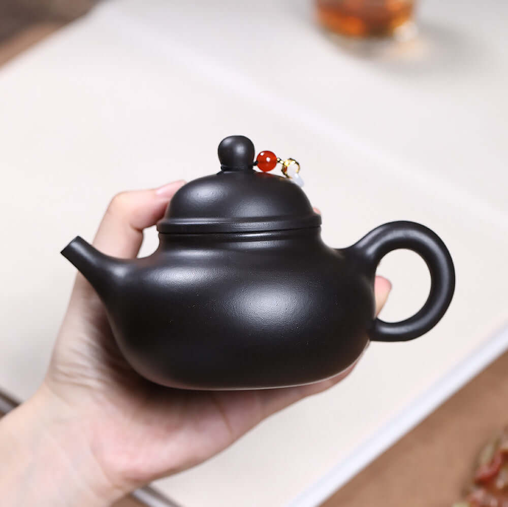 Handmade Yixing purple sand teapot in gray matte finish, designed for Kung Fu tea ceremonies, perfect for home use.
