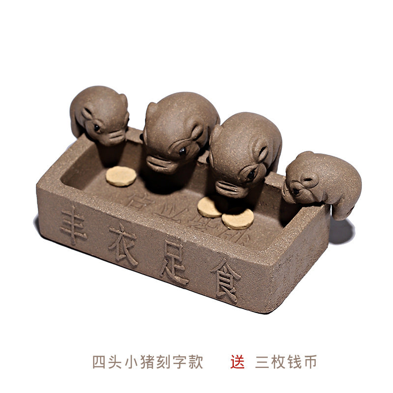 Handmade Yixing purple sand tea pet with four piglet ornaments around a food dish, featuring three coins.