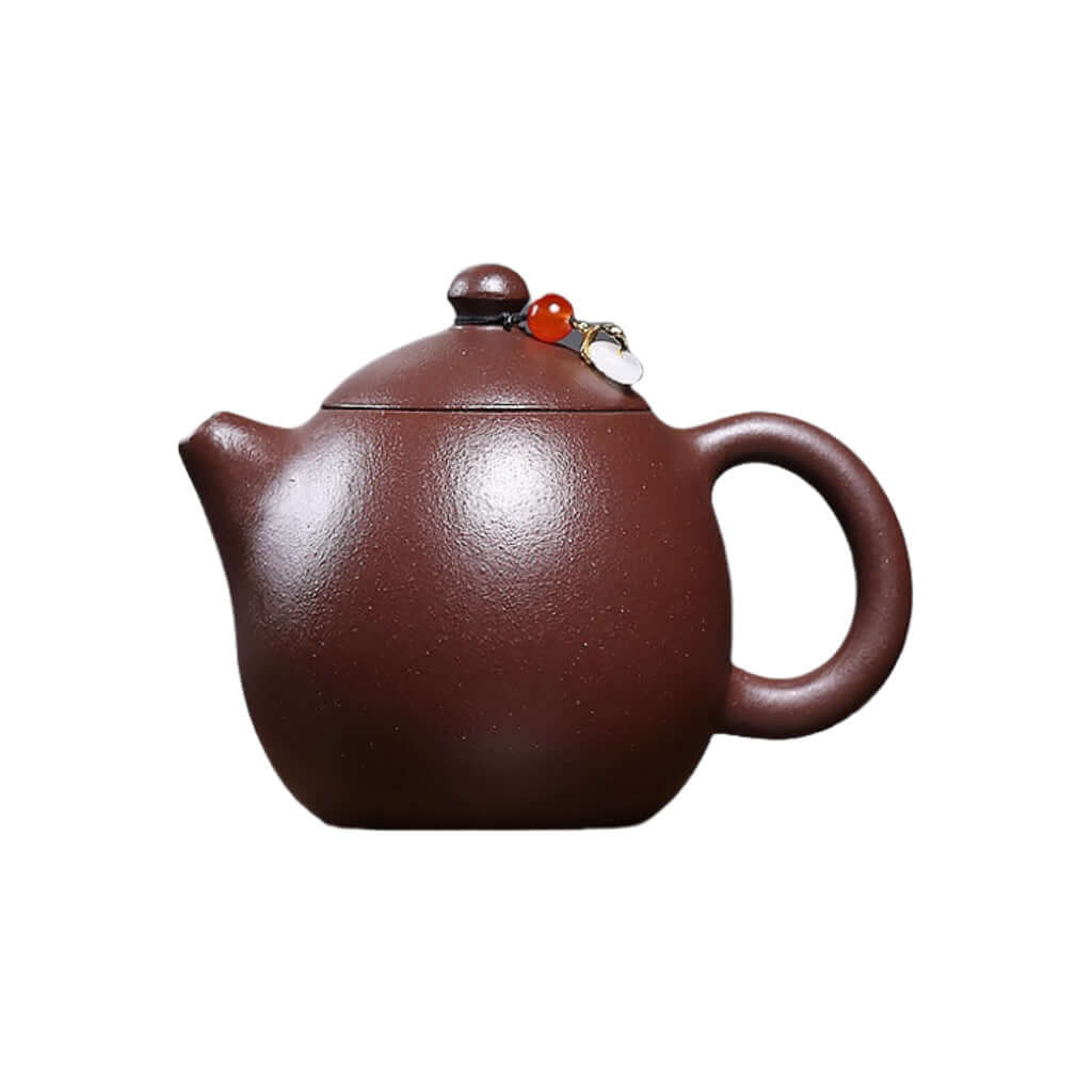 Handmade Yixing purple sand teapot with decorative lid and smooth finish, perfect for a Kung Fu tea set.