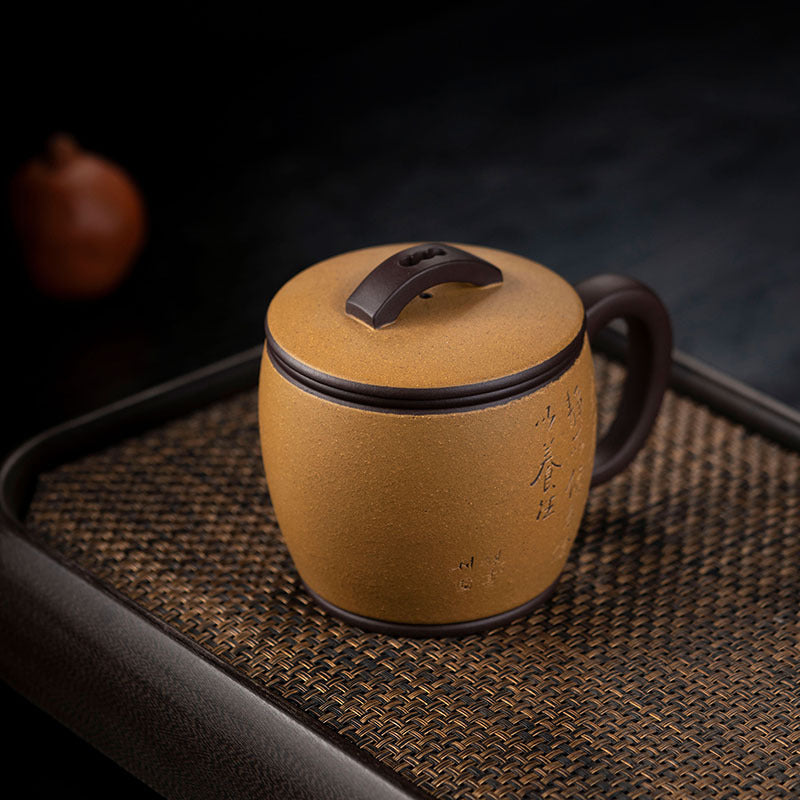 Handmade Yixing purple sand tea cup with a brown lid, showcasing unique craftsmanship and traditional design, ideal for tea lovers.