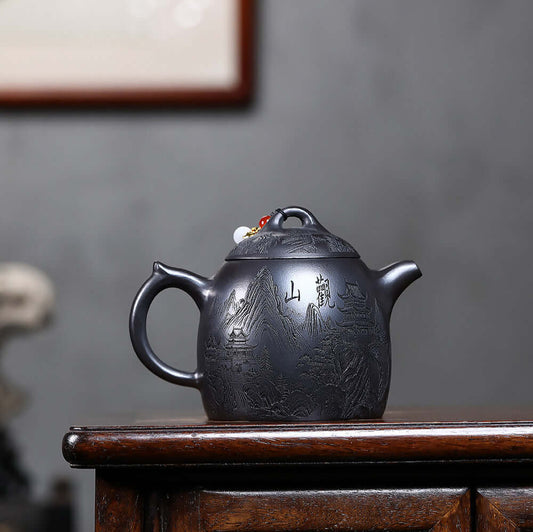 Handmade Yixing purple sand teapot featuring intricate designs, perfect for Kung Fu tea ceremonies.