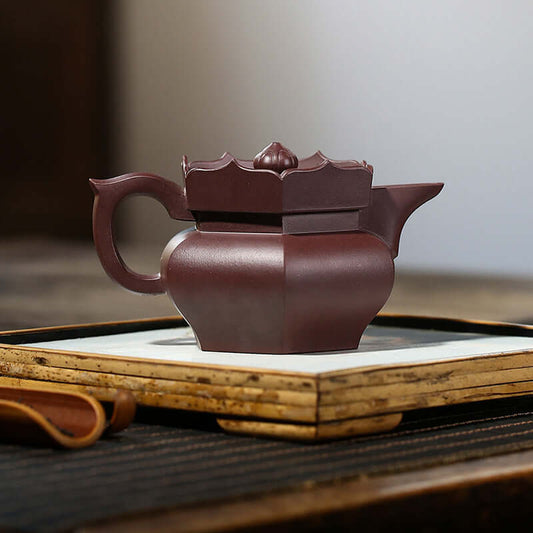 Handmade Yixing purple sand teapot with elegant design, perfect for tea lovers and high-end gifts.