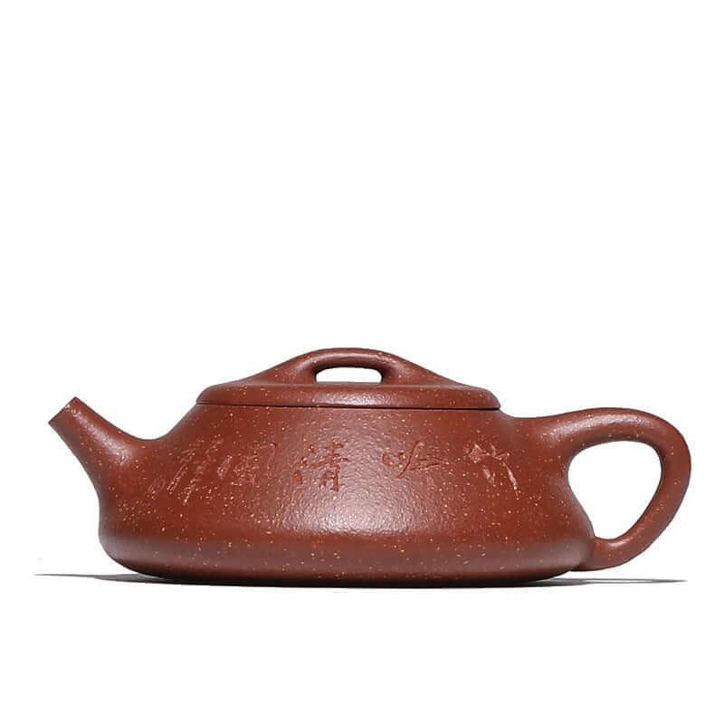 Handmade Yixing purple sand teapot with elegant design and unique inscriptions, showcasing authentic craftsmanship.