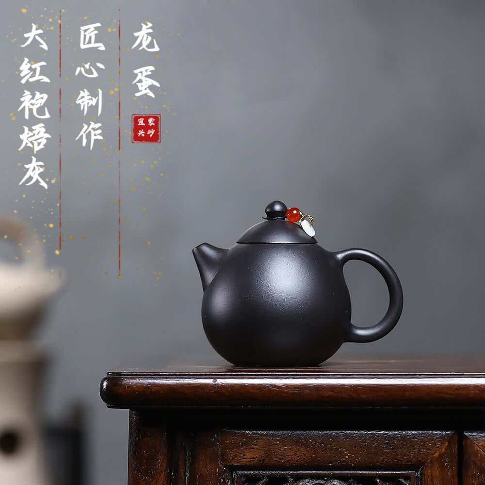 Handmade Yixing purple sand teapot with a smooth finish, perfect for Kung Fu tea sets.