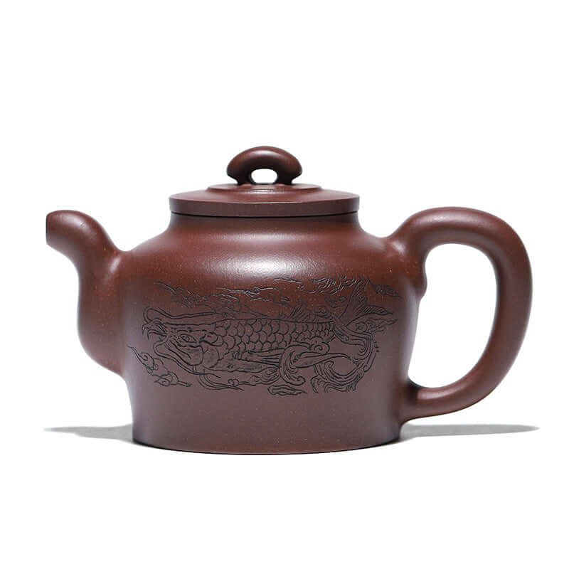 Handmade Yixing purple sand teapot featuring intricately carved dragon design, showcasing exquisite craftsmanship.