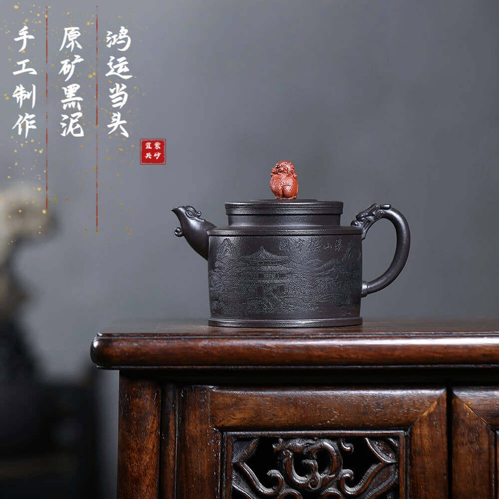 Handmade Yixing purple sand teapot, crafted from raw ore black mud, featuring an engraved design for Kung Fu tea sets.