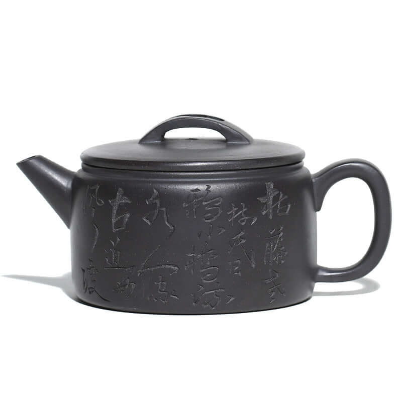 Handmade Yixing purple sand teapot with elegant inscriptions, showcasing traditional craftsmanship and design.