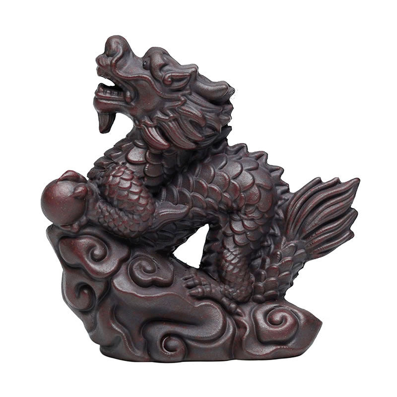 Handmade Yixing purple sand dragon tea pet ornament for tea ceremonies, showcasing craftsmanship and elegance.