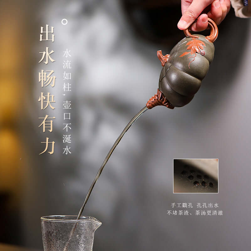 Handmade Yixing purple sand teapot pouring water gracefully, showcasing its unique design and craftsmanship.