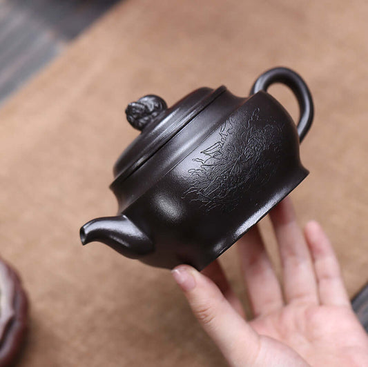 Handmade Yixing purple sand teapot featuring original mineral black clay, ideal for Kung Fu tea ceremonies.