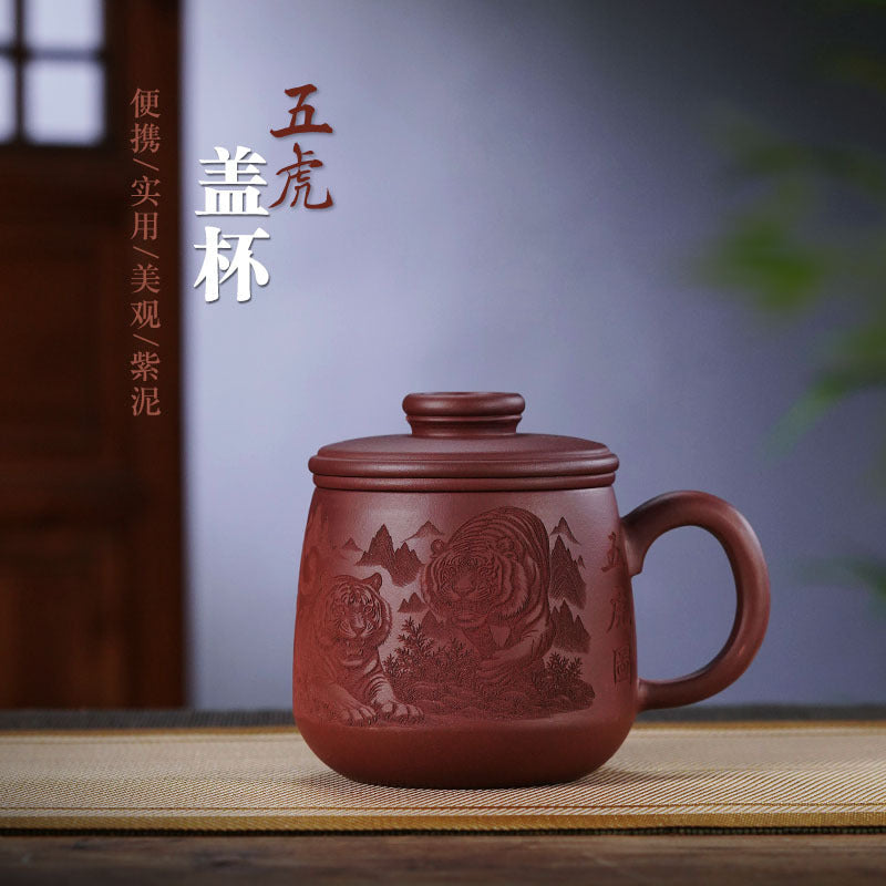 Handmade Yixing purple sand tea cup with engraved tiger design, perfect for tea lovers and office gifting.