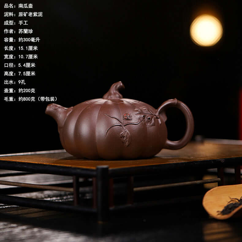 Handmade Yixing purple sand teapot in pumpkin shape, crafted from original purple sand for home tea brewing.