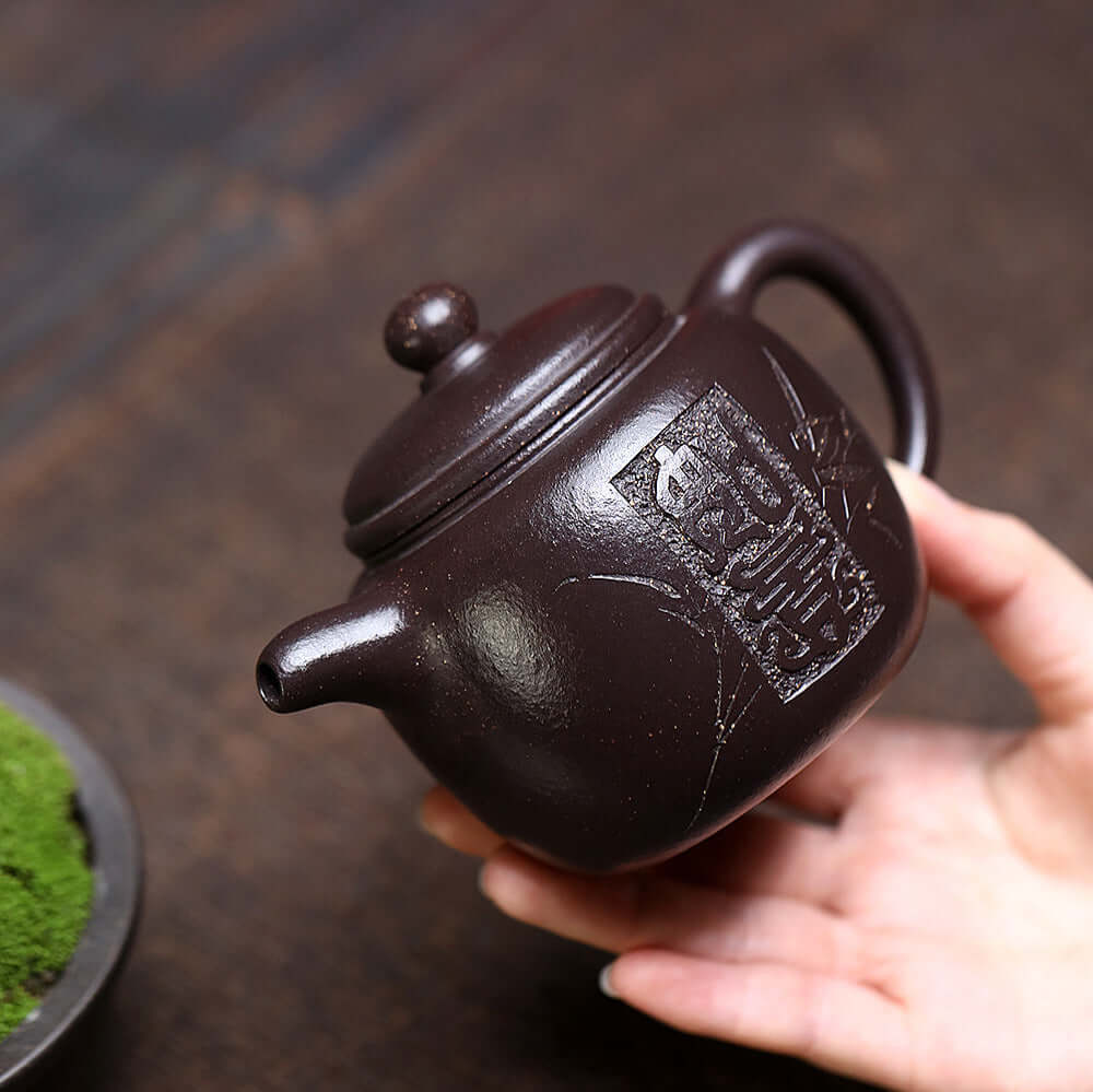 Handmade Yixing purple sand teapot, original craftsmanship, featuring intricate design and perfect for Kung Fu tea sets.