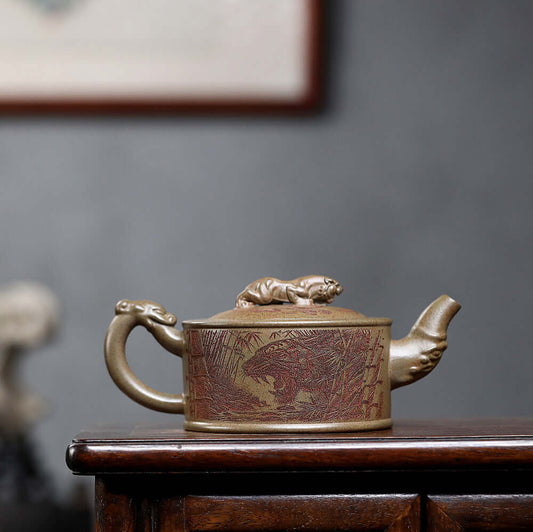 Handmade Yixing purple sand teapot with dragon and tiger design, crafted from raw ore for tea enthusiasts.